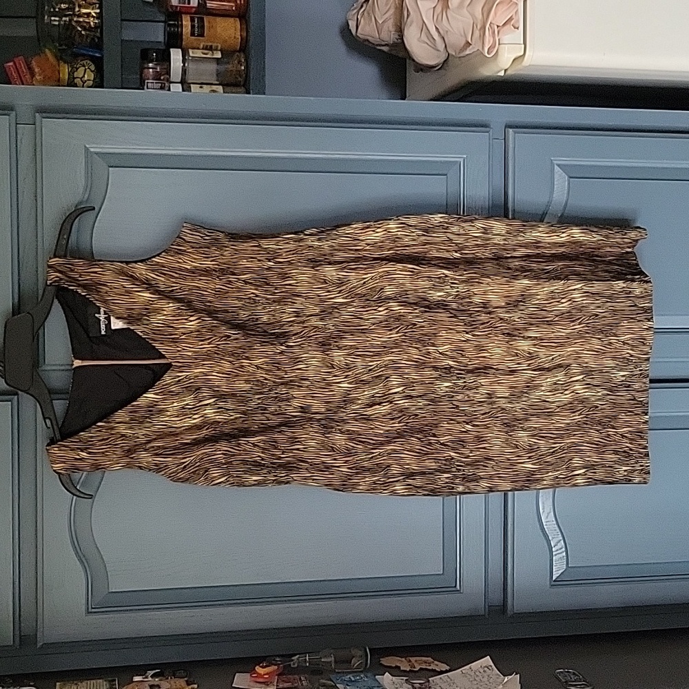 Like new faux tiger print dress. Zipper in back.  Small slit in back